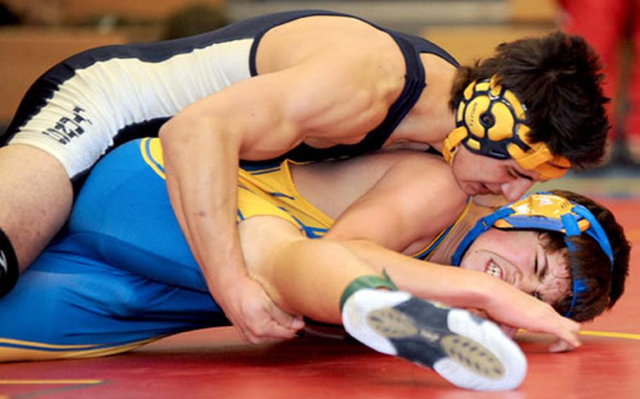 Heidelberg&#39;s Andres Nanez, top, puts the pressure on Daniel Mariscal of Ansbach in a 145-pound match in Heidelberg on Saturday. Nanez won the match.