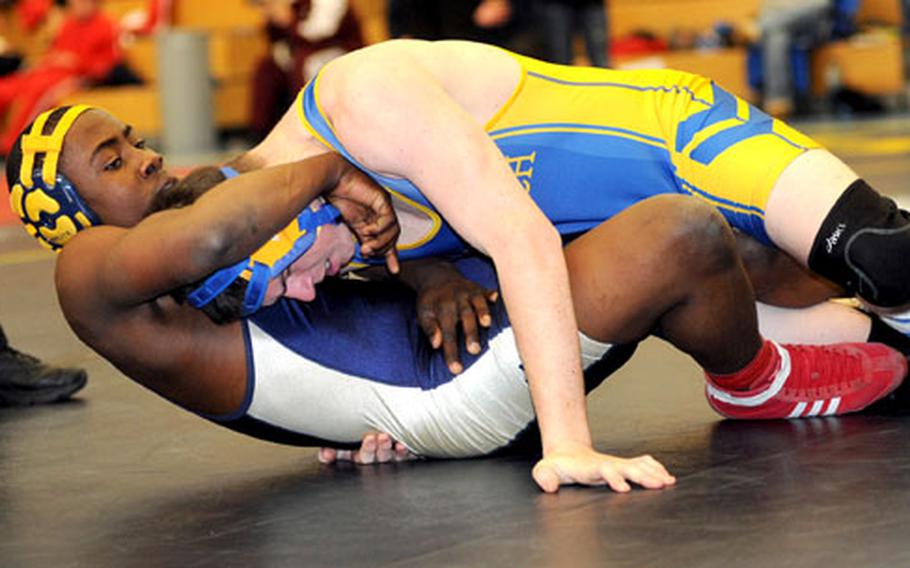 Ansbach&#39;s Jared Jones, top, and Heidelberg&#39;s Frank Tchaumbou face off in a 189-pound match in Heidelberg on Saturday. Jones won the match with a fall.