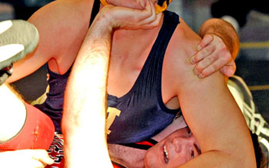 Kaiserslautern&#39;s Chris Murray, bottom, struggles to stop Heidelberg&#39;s Jonathan Brown form pinning him. Murray got out of this predicament and went on to win a close 189-pound match in Heidelberg on Saturday.