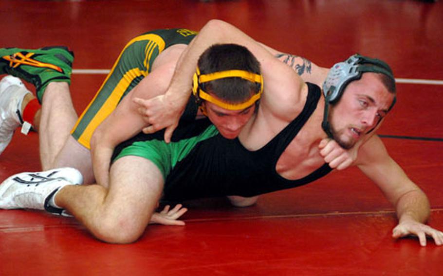 Robert D. Edgren&#39;s Darrel Morris, top, and Kubasaki&#39;s Jake "Cowboy" Haynes tangle during Saturday&#39;s 158-pound championship bout in the 2009 Nile C. Kinnick Invitational "Beast of the Far East" Wrestling Tournament at Yokosuka Middle School, Yokosuka Naval Base, Japan. Morris edged Haynes by 2-0 decision (2-1, 4-1).