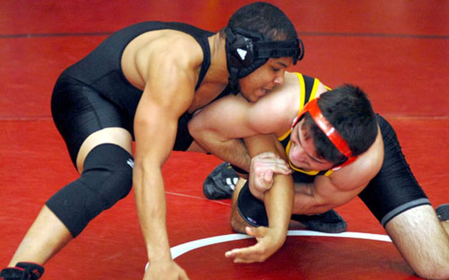 Kadena&#39;s Harry Bloom, right, tried to tie up Zama American&#39;s Elias Labrador during Saturday&#39;s 148-pound championship bout. Labrador upset the reigning Far East gold medalist Bloom by 2-1 decision.