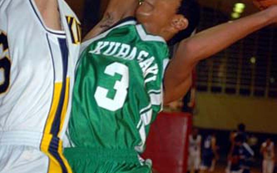Kai Yamaguchi (3) of Kubasaki tries to shoot against Sho Yamakawa of Kitanakagusuku, a Japanese high school team, during Friday&#39;s pool play in the 3rd Okinawa-American Shootout tournament at Court 1, Foster Field House, Foster Athletics Complex, Camp Foster, Okinawa. Yamaguchi&#39;s Dragons beat Yamakawa&#39;s Fighting Lions 62-58.