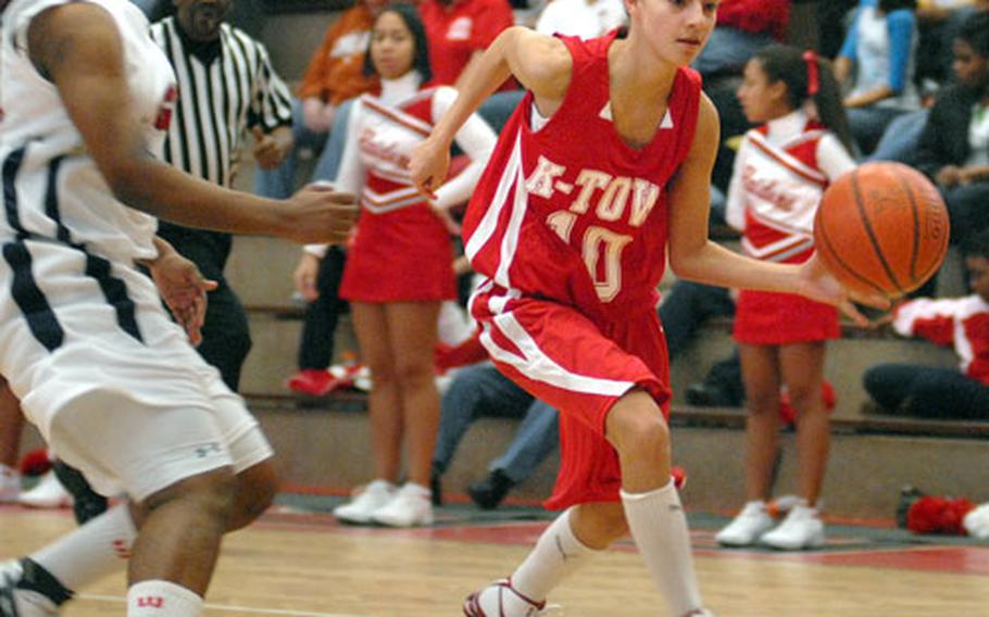 Tracey Ely of Kaiserslautern drives around Keya Gunter of Lakenheath.