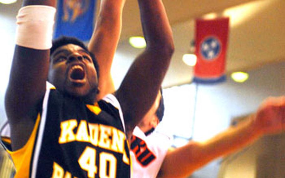 Kadena Panthers center Jordan Ray puts up a shot in front of an Oroku defender during Sunday&#39;s championship game.