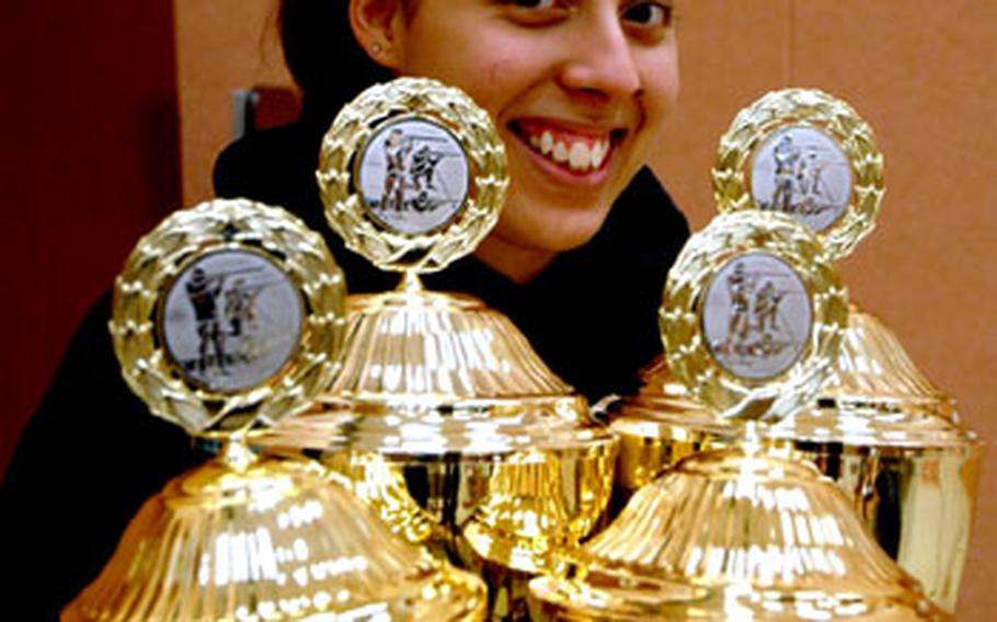 Jessica Walloch is all smiles after picking up awards for top shooter of the year, top shooter of the day, and top scorer in prone and standing positions for the day.