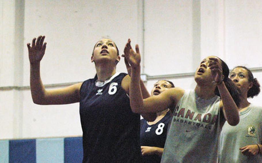 Jasmine Mailoto, left, a 6-foot-1 freshman center for Aviano, can take up a lot of space near the basket for the Saints, a big advantage when it comes to fighting for rebounds.