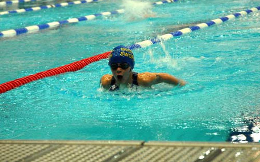 Hallie Kinsey, 8, of Sigonalla, Italy, swims the butterfly leg of her record-shattering 200-meter individual medley race during the 2009 European Forces Swim League Championships at Berlin’s Europa Sportpark Saturday.