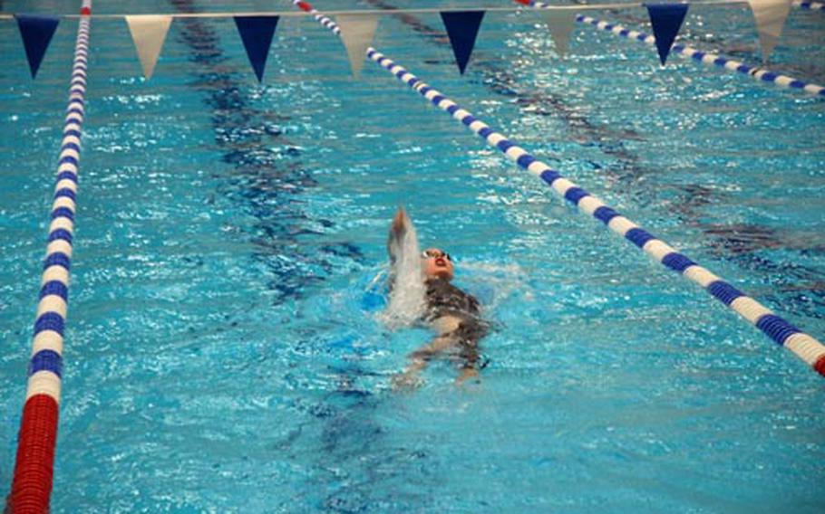 Doing the backstroke leg of her 200-meter individual medley race, Lauren Drake, 17, representing the NATO Marlins of Belgium, powers her way to a gold medal at the 2009 European Forces Swim League Championships at Berlin’s Europa Sportpark Sunday. Drake set four league records during the meet.