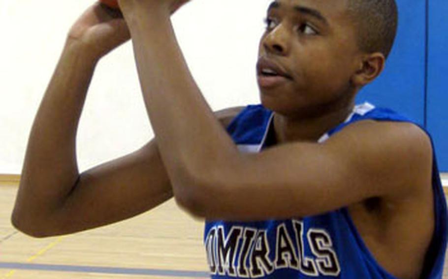 Rota's freshman scoring ace Tre'von Owens lines up a free-throw try during a practice session Wednesday at Rota, Spain.