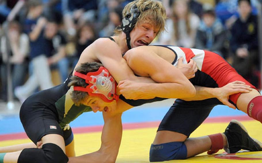 Lakenheath&#39;s Brandon Searle, right, defeated AFNORTH&#39;s J.J. Donohue for the 119-pound crown at the 2009 DODDS-Europe wrestling championships in Wiesbaden, Germany, on Saturday. For a photo gallery of all the finalists, see link at top of story.