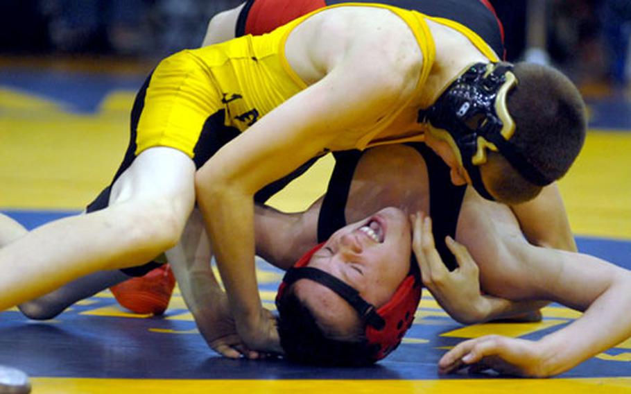 Kadena's Nick Breier wrenches Nile C. Kinnick's Marcus Boehler's shoulders toward the mat during Saturday's 101-pound bout in the dual-meet championship of the 2009 DODDS-Pacific Far East High School Wrestling Tournament. Breier pinned Far East champion Boehler in 3 minutes, 17 seconds, and Kadena beat Kinnick 45-14 in the most lopsided dual-meet final outcome in Far East tournament history.