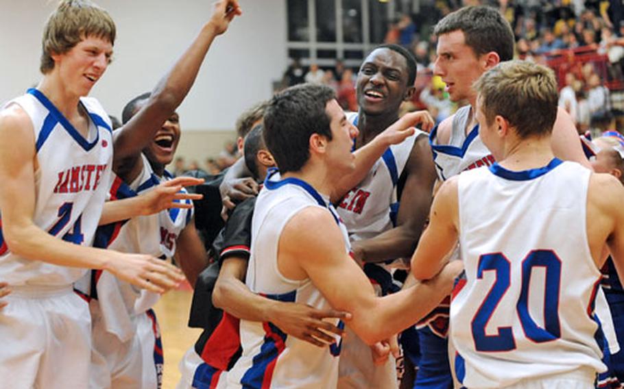 The Ramstein Royals celebrate their 53-47 win over Heidelberg in the Division I championship game at the DODDS-Europe basketball finals at Mannheim, Germany, on Friday night.