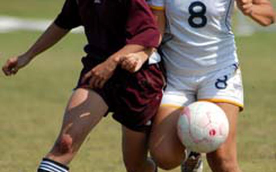 Perry’s Karla Stroud, left, battles Faith Academy’s Anna Bright for the ball during a quarterfinal match in the 2008 Far East High School Girls Class A Soccer Tournament at Marine Corps Air Station Iwakuni, Japan. Faith eliminated Perry 3-2. Stroud, who scored 20 goals last season, is one of eight returning starters for the Samurai.