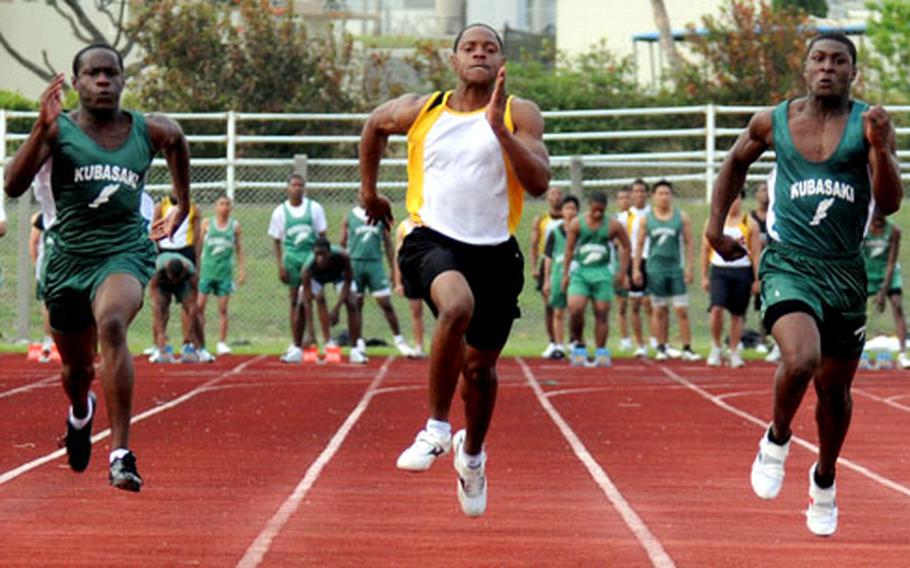 Kubasaki&#39;s Lewis Finney, Kadena&#39;s Brandon Harris and Kubasaki&#39;s Maquette Warren pound for the finish line in the 100. Harris won in 11.65 seconds; Warren was second in 11.88 and Finney third in 12.01.