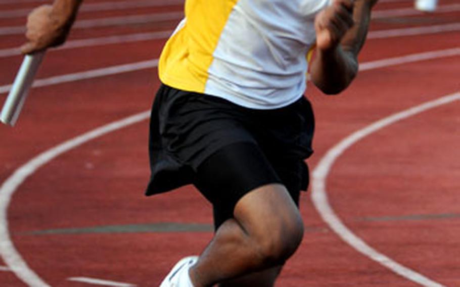 Kadena senior Brandon Harris heads for home in the boys 400 relay. Kadena won the relay in 46.5 seconds.