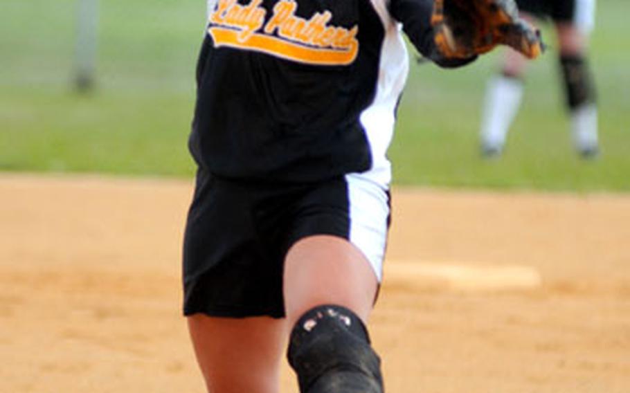 Kadena Panthers junior righthander Mary Schweers goes into her delivery against the Kubasaki Dragons during Wednesday&#39;s Okinawa Activities Council season-opening girls softball game at Camp Foster, Okinawa. Schweers gave up a run on two hits with three walks and two strikeouts in 2 2/3 innings, but left with a knee injury in the third inning. Desiree Seals got the win in relief as the six-time island champion Panthers beat the Dragons 10-5 in a game delayed for nearly two weeks by rainouts.