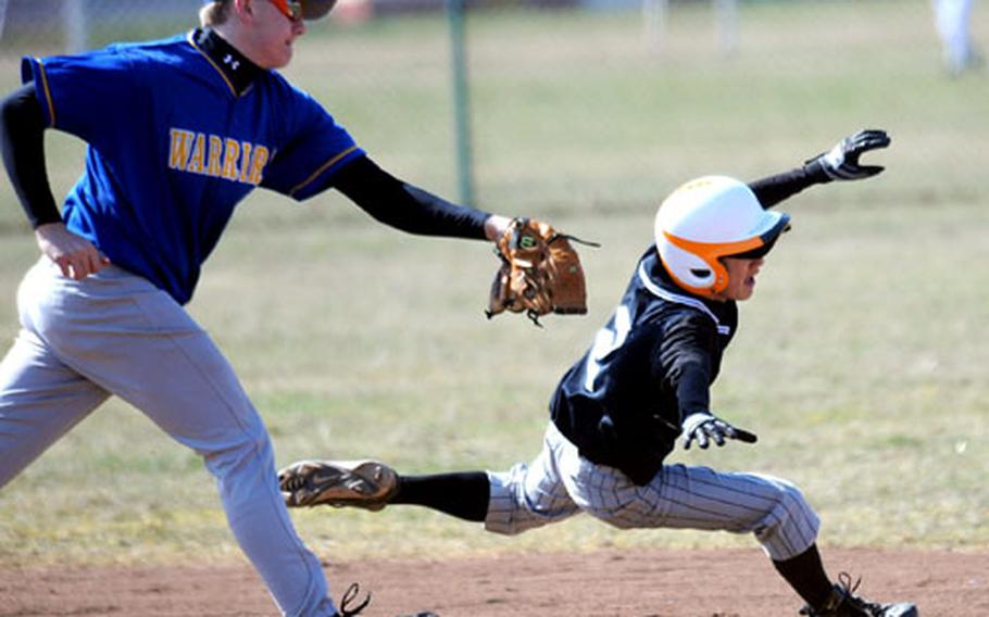 Wiesbaden&#39;s Chance Martin gets ready to tag out Patch&#39;s Timi Huang, who got caught in a rundown in the second game of an opening-day baseball doubleheader. Patch swept Wiesbaden 25-0, 12-1 in the inaugural season of DODDS baseball in Europe.