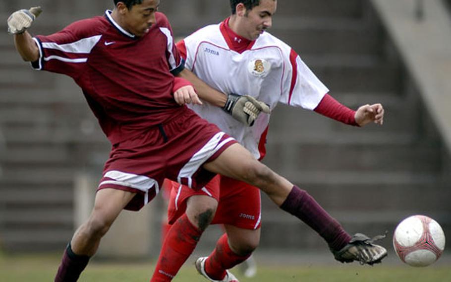 Alex Birotte from Kaiserslautern, right, moves in for a steal attempt against Joshua Davidson of Vilseck during their game Saturday at Kaiserslautern. Kaiserslautern shut out Vilseck 3-0 in a battle of D-I foes.