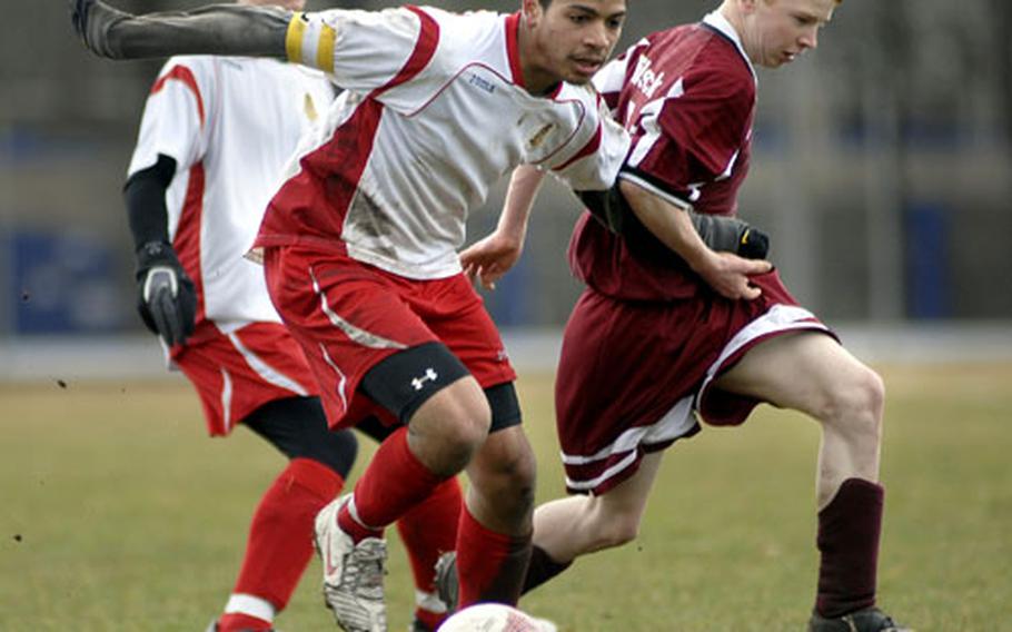 Ishmael Hampton from Kaiserslautern battles with Zane Kennedy of Vilseck for possession of the ball.