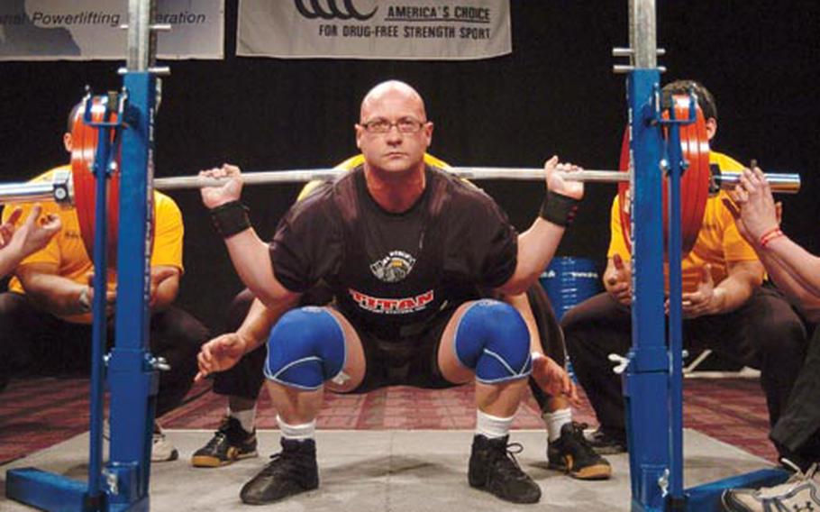 Military power lifting champion Troy Saunders, 40, of Ramstein squats with 568 pounds March 14 during the National Military Championships at Killeen, Texas.