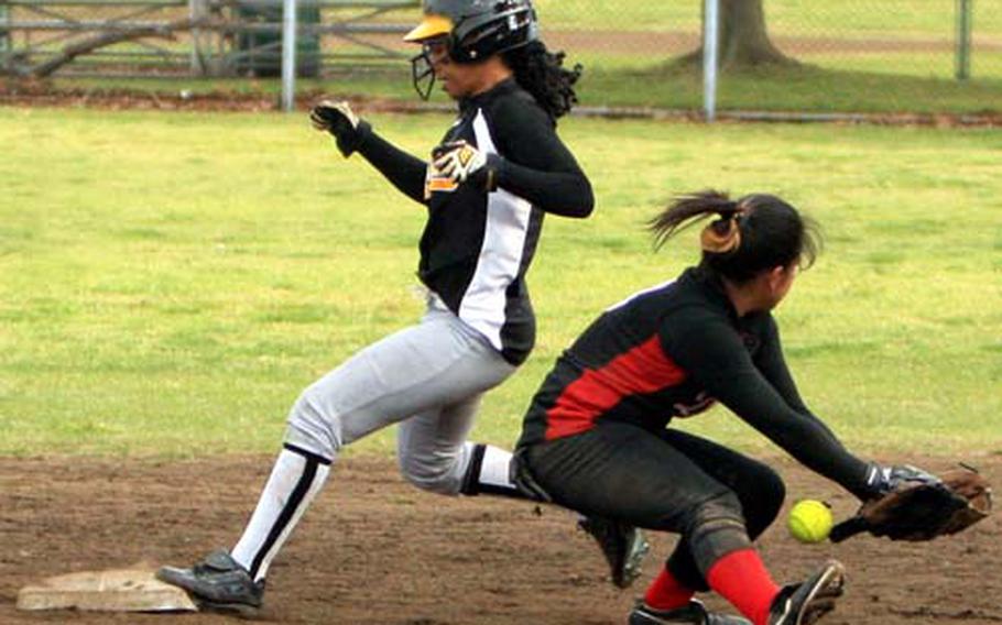 Kadena Panthers baserunner Shannon Scott steams into second base safely as Nile C. Kinnick Red Devils infielder Arisa Hirashima can&#39;t find the handle on the ball during Saturday&#39;s championship game in the 2009 DODDS-Japan Girls Softball Tournament at Naval Air Facility Atsugi, Japan. Scott had three RBIs, earned tournament Most Outstanding Player honors and Kadena beat Kinnick 11-4 for the title.