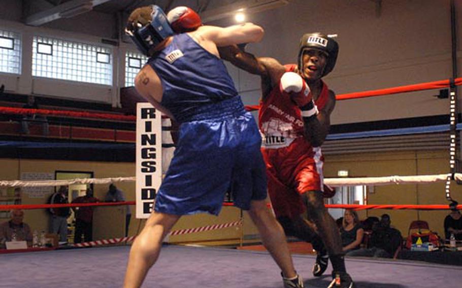 Frank Horsey, 27, from Kaiserslautern, throws a right hand at Anthony Jones, 30, from Lajes, during a U.S. Forces Europe championship bout Saturday at Miesau, Germany. Horsey defeated Jones in the second round after the referee stopped the fight.