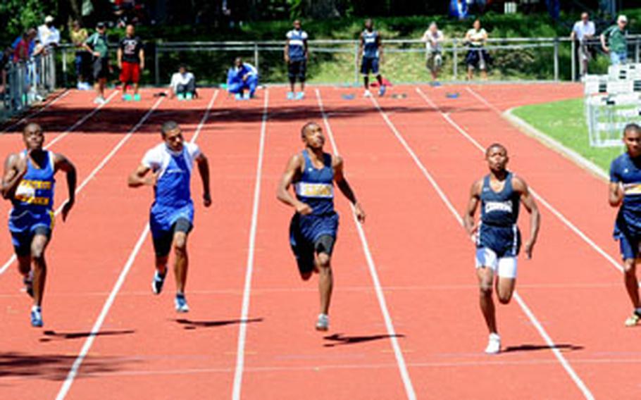 Devin Jenkins of Lakenheath, third from right, wins the boys 100 meter dash in 11.32 seconds. Second was Chris Frazier of Heidelberg, fourth from right, in 11.44, while Julian Ardley, second from left, was third at 11.58.