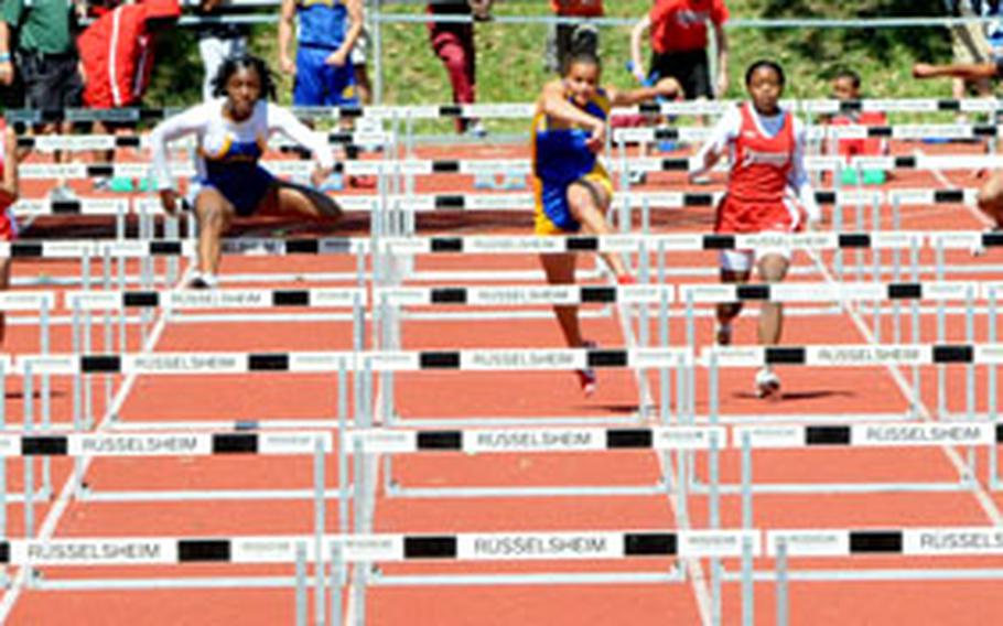 Tiffany Heard of Ansbach, third from left, gets off to a fast start to win the girls 110 meter hurdles in 15.08 seconds. Rebecca Borner of Wiesbaden, fourth from left, was second in 16.06 seconds.
