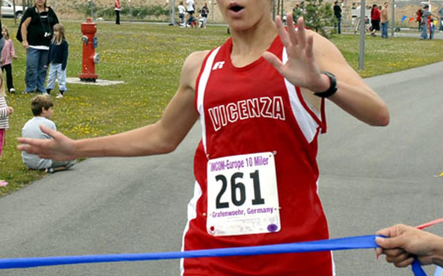 Army Capt. Stephanie Feagin, 28, crosses the finish line. Feagin finished first among active-duty Army women with a time of 1 hour, 5 minutes and 21 seconds.
