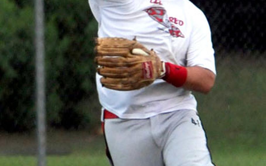 Left fielder Shawn Curtis of Club Red of Okinawa guns the ball back to the infield against Yongsan Garrison of South Korea during Friday's pool-play game in the 2009 Firecracker Shootout. Yongsan beat Club Red 20-10.