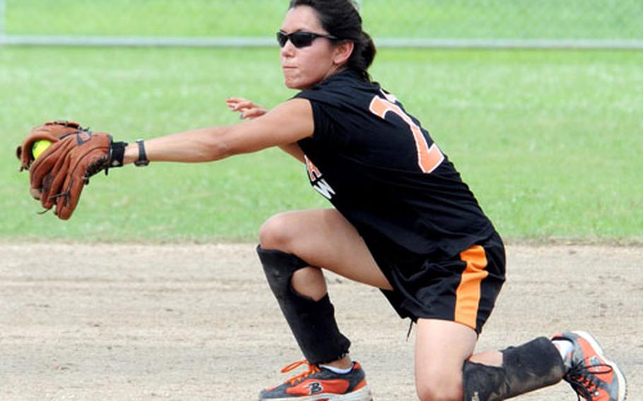 Shortstop Sandra "Gonzo" Gonzales of Yongsan Garrison, South Korea, snags a hard grounder by Yard Busters of Okinawa during Saturday&#39;s double-elimination championship bracket game in the 2009 Firecracker Shootout Interservice Softball Tournament. Yongsan beat Yard Busters 12-6.