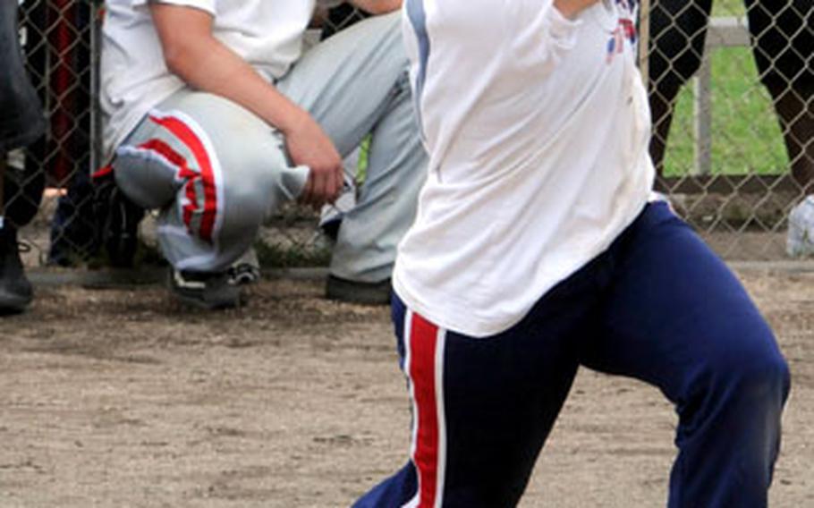 Outfielder Amanda Maestas of Osan Air Base, South Korea, watches the flight of a popup against the Misawa Air Base Outlaws of Japan during Saturday&#39;s double-elimination knockout game. Misawa edged Osan 8-5.