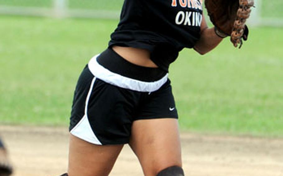 Second baseman Maria Garcia of Yongsan Garrison, South Korea, makes the throw to first base for the final out against Yard Busters of Okinawa during Saturday&#39;s double-elimination championship bracket game. Yongsan beat Yard Busters 12-6. Garcia is a senior fastpitch infielder for Seoul American High School.
