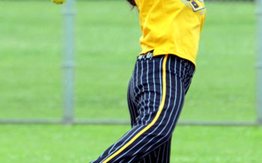 Second baseman Patricia Kennington of Okinawa Yard Busters can&#39;t get a grip on a line drive by Pitchslap of Okinawa during Sunday&#39;s women&#39;s championship game. Yard Busters captured their first Pacific Grand Slam tournament title, beating Pitchslap 11-0 in the first championship game and 10-3 in the clincher.