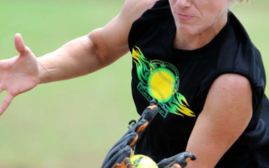 Third baseman Rebecca Sapp of Pitchslap of Okinawa catches a foul popup.