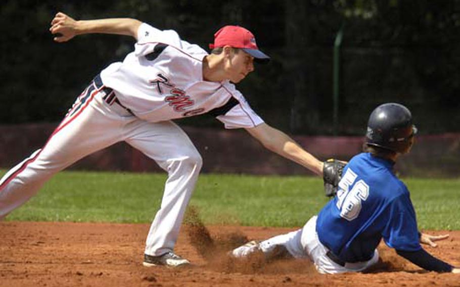 Cavan Cohoes of the Kaiserslautern Military Community All-Stars tags out Marco Gheno of Italy early in the 2nd inning Monday at a field in Vogelweh. KMC defeated Italy 11-9 in the second day of the Senior League baseball tournament.