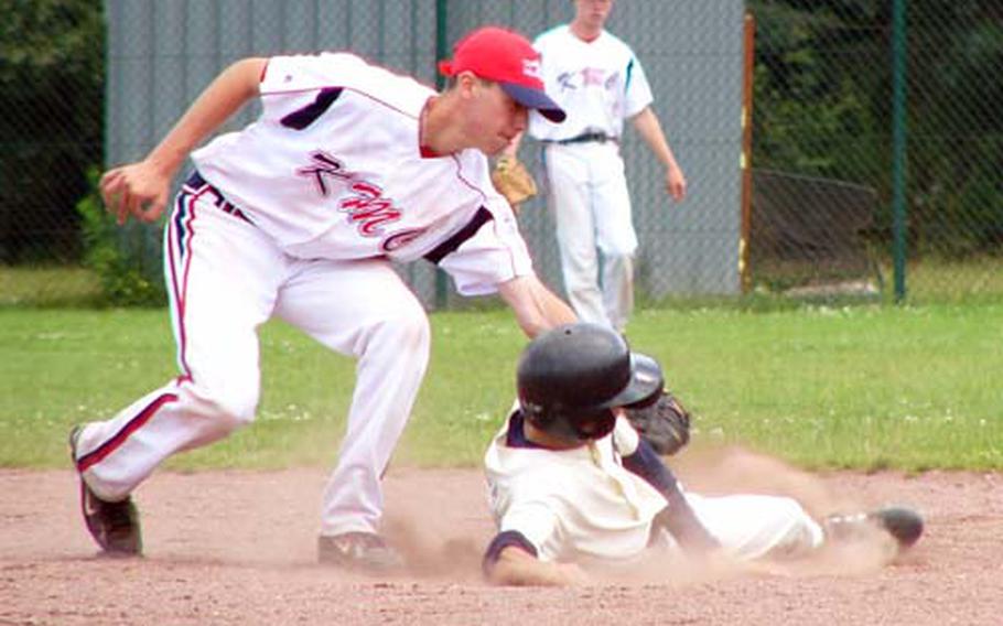 Cavan Cohoes tags out Moldova’s Vadim Balan on an attempted steal of second Thursday during KMC’s 9-5 victory in the final round-robin game of the six-day European Senior League Regional at Ramstein Air Base, Germany.