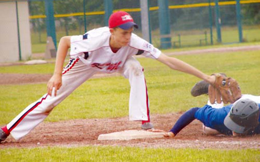 Italy base runner Luca Ainger just beats the sweep tag of Kaiserslautern military community first baseman Tyler Breed during Italy’s 6-5 semifinal victory Friday in Little League Baseball’s Senior League European Regional tournament at Ramstein Air Base, Germany.