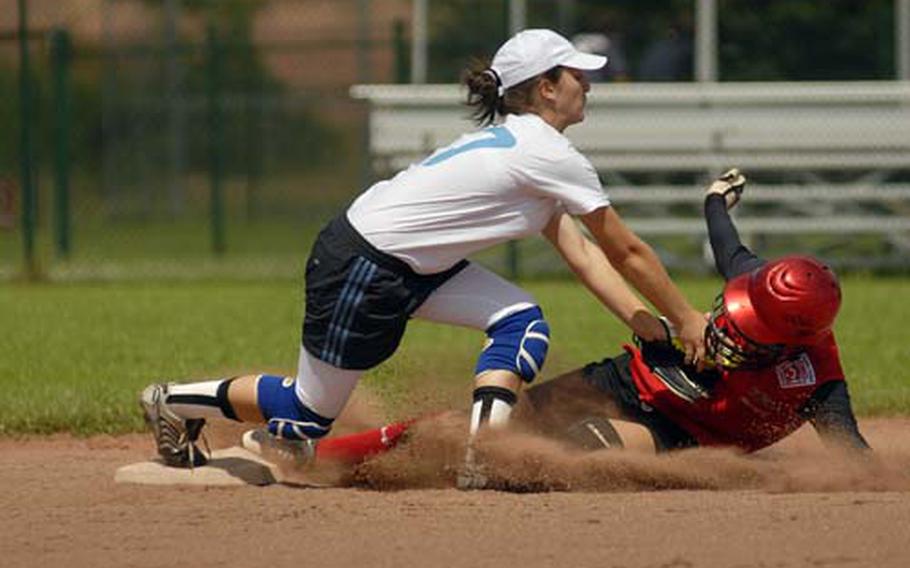 KMC’s Caitlyn Sheets slides into Salome Osefashuili of Georgia on Monday afternoon in their second game of the Senior League European Regional at Ramstein. The Germany team, comprised of American military dependants, won both games, 16-0 and 24-1. Sheets was tagged out on the play.