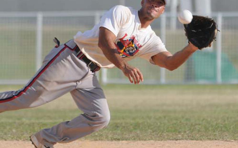 American Legion shortstop Chris "Smoke" Stevens dives for a line drive off a 1st Marine Aircraft Wing bat during Saturday&#39;s last game of the Marine Corps Community Services Semper Fit Okinawa pre-Far East Regional Softball Tournament at Field 1, Gunners Fitness Center Softball Complex, Camp Foster, Okinawa. Legion prevailed 15-14 and went unbeaten in the tournament, two games ahead of Wing.