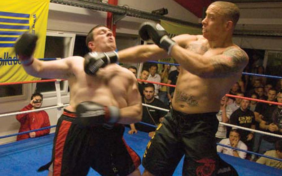 Marine Sgt. Micah Terry lands a straight right on Vüseyin Usta during a Muay Thai kickboxing bout at the Fight Sports Center in Leinfelden-Echterdingen, Germany, on Saturday night. Terry’s victory earned him a sponsorship from Take a Nap Fight Gear.