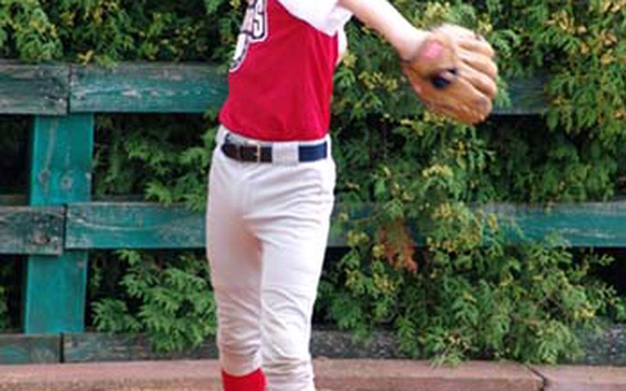Eventual winning pitcher Matt Zembraski of the Kaiserslautern Military Community All-Stars warms up prior to his 12-strikeout performance in Wednesday’s pool-play victory over England.