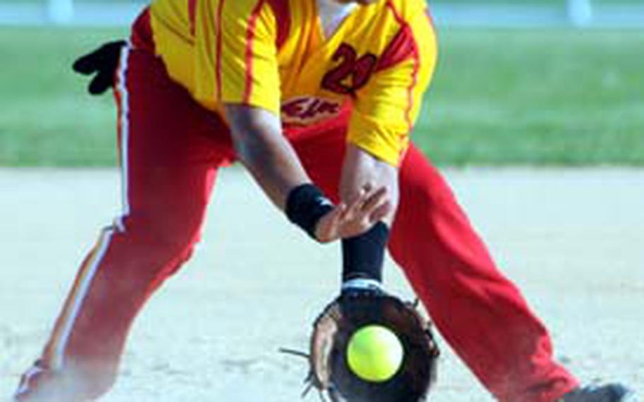 Third baseman Justin Rodriguez of Marine Corps Air Statiion Iwakuni, Japan, fields a Marine Corps Base Camp S.D. Butler ground ball Tuesday in the Marine Corps Far East Regional Softball Tournament at Camp Foster, Okinawa. Iwakuni beat Base 12-1.