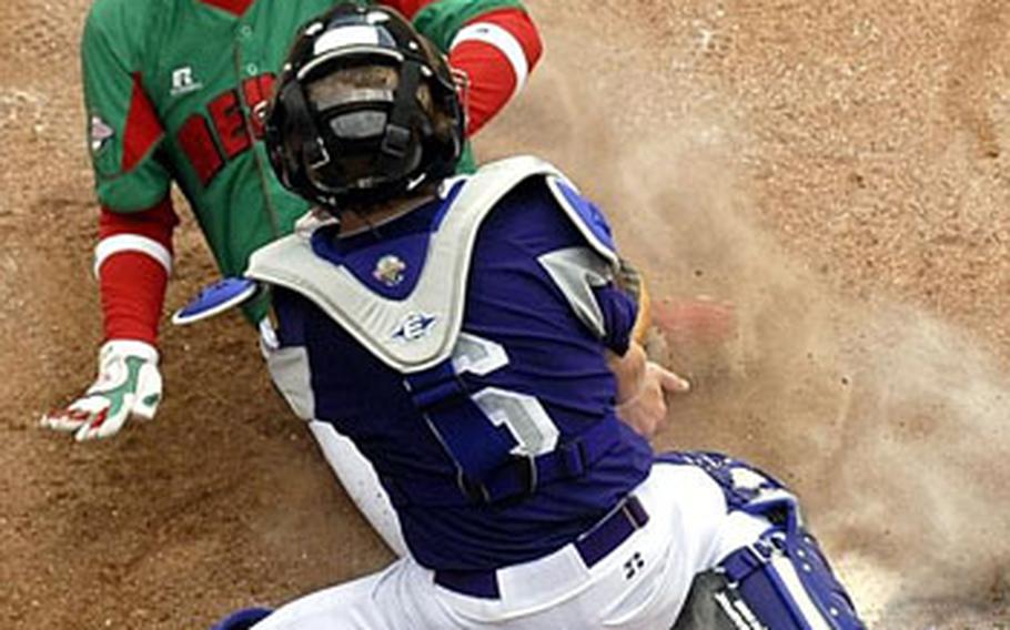 Reynosa, Mexico&#39;s Luis Perez slides under the tag of Ramstein AFB, Germany catcher Matt Zembraski, scoring in the fourth inning of Little League World Series baseball pool play.