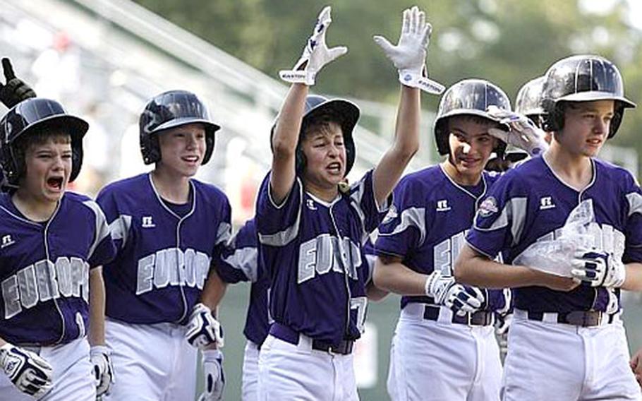 KMC&#39;s Chris Holba, center, celebrates with teammates after he hit a grand slam in the fifth inning against Vancouver, British Columbia, at the Little League World Series on Tuesday.