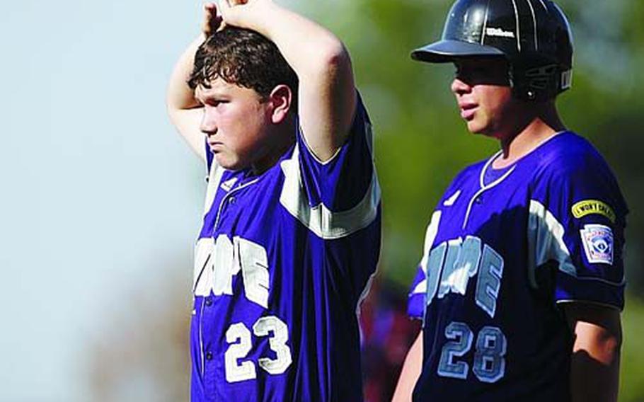 Ramstein AFB, Germany, teammates Cannon Byrd, left, and Michael Bega walk to shake hands with Vancouver, British Columbia, after losing 14-13 during Little League World Series pool play, Tuesday, Aug. 25, 2009, in South Williamsport, Pa.