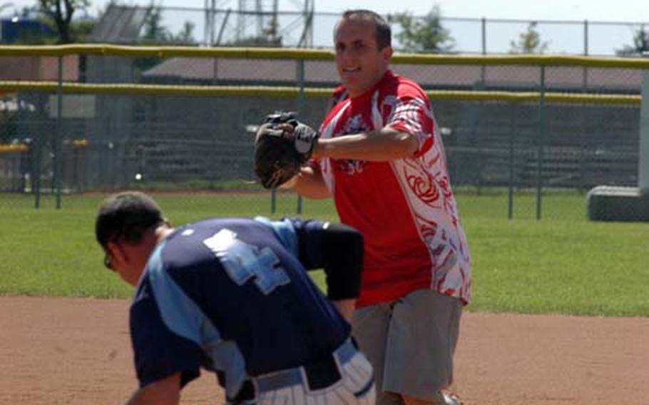 Aviano shortstop John Grice steps on second base to force Lakenheath&#39;s Todd Seefeldt before making the throw to first in a double play. The Dragons, only playing in the tournament after another team dropped out, won the title of the Army-Air Force Final Four softball championships.