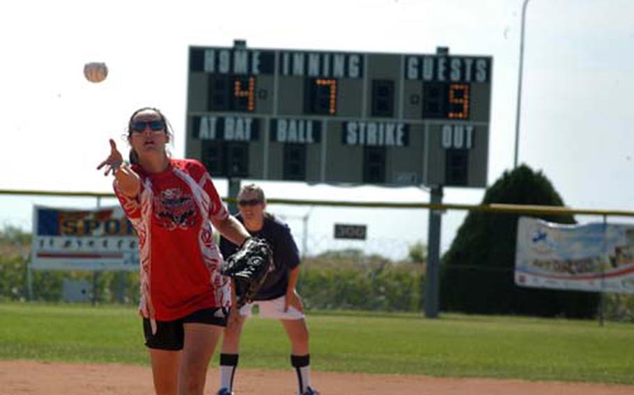 Aviano pitcher Mary Wilkerson throws the ball toward the plate in the Dragons&#39; 9-7 victory in the first game of the Army-Air Force Final Four softball championships Sunday at Aviano. Lakenheath, which hadn&#39;t lost in the tournament, rallied for three runs in the final inning and had the tying runs on base. But the rally came up short, forcing a second game.