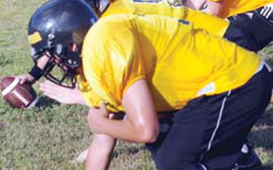 Kadena Panthers senior quarterback Stanley Schrock calls signals during Thursday’s football practice at Kadena Air Base, Okinawa.