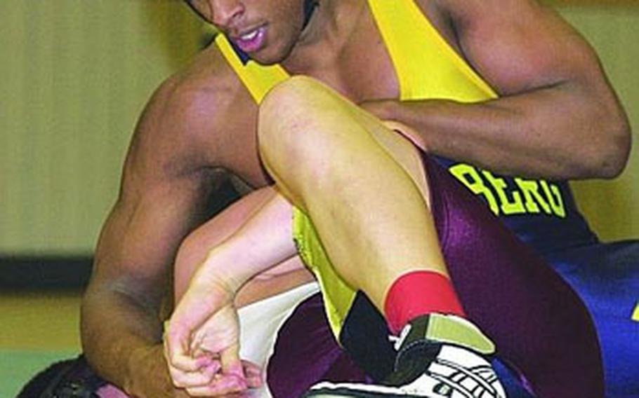 Donald Walker of Heidelberg, top, tries to turn David Garcia of Vilseck during the 171-pound final in the 2003 DODDS European wrestling championships in Wiesbaden, Germany. Walker won the match to finish the season undefeated.